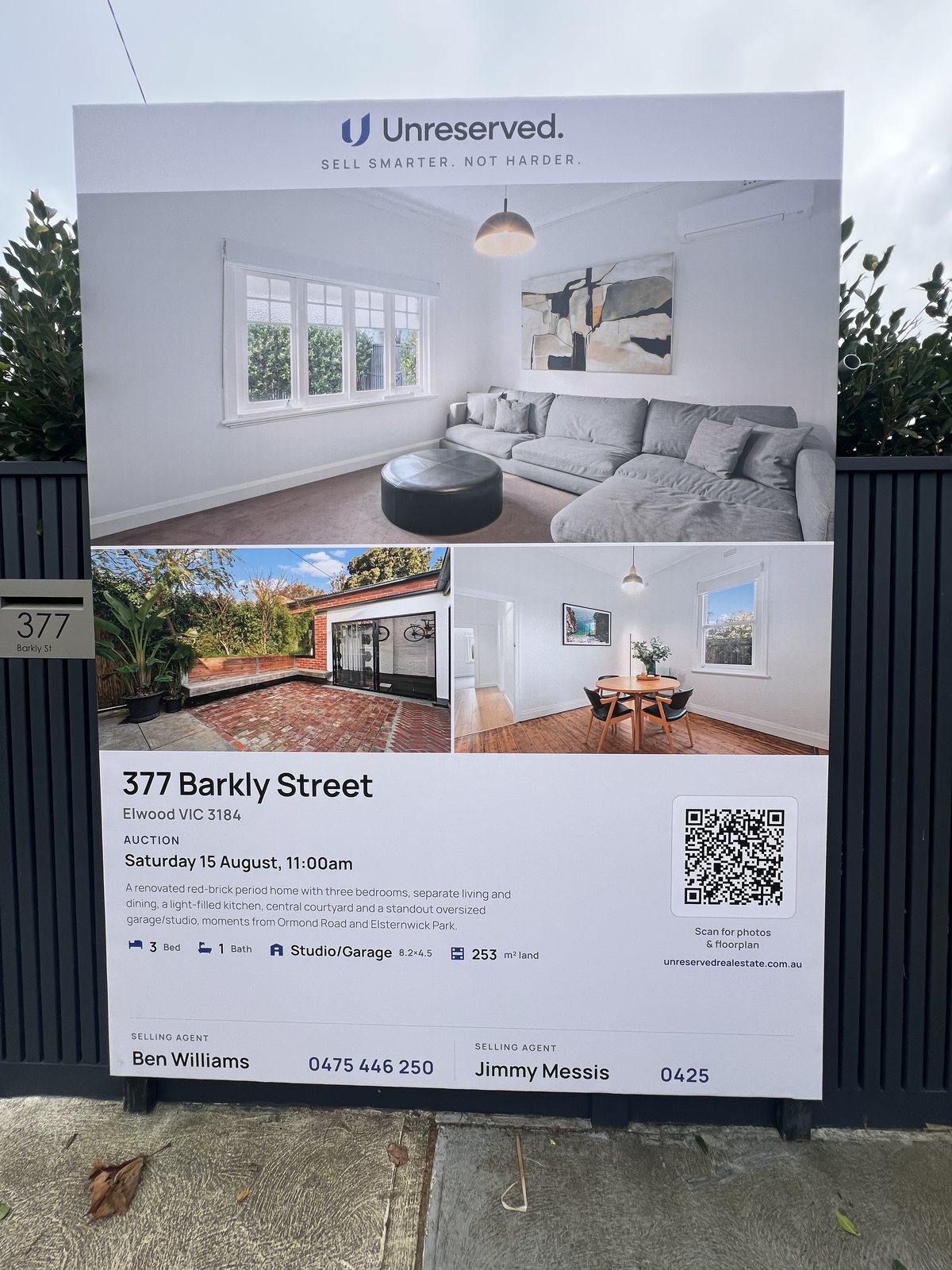 An XL Unreserved photo signboard showing three property photos, auction details, contacts and a QR code